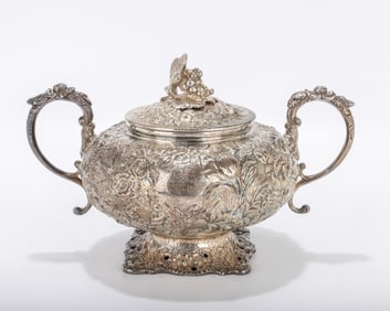 A LARGE COVERED SUGAR HOLDER BY KIRK.  Hand embossed in repousee design. 9 inches wide.. 26. 23 ozt.