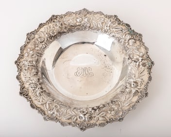A LARGE STERLING SILVER SERVING DISH BY KIRK.  Hand embossed in repousee design. 11.2 inches wide.