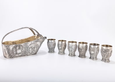 A DUTCH SILVER WINE CUP SET. The Netherlands, c. 1920. Each cup is 3 inches tall. The holder is 10