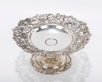 A STERLING SILVER FOOTED COMPOTE BY DOMINICH AN HAFF. American, c. 1900. On a round base with a