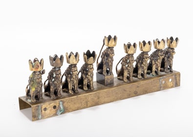 A BRASS LION HANUKKAH LAMP. Probably Germany, c. 1900. On a rectangle base with lion shaped candle