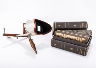 A STEREOSCOPE WITH A COLLECTION OF STEREO CARDS OF PALESTINE. Underwood and Underwood. In a book