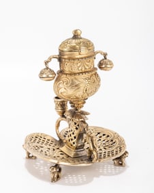 A GILDED SPICE CONTAINER. Europe, 20th century. On four feet and a stylized base with two bells.