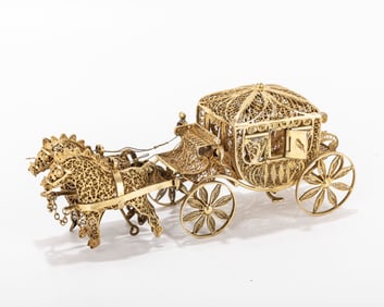 A FILIGREE SPICE CONTAINER. Continental, modern. In the shape of a horse driven wagon