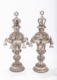 A PAIR OF SILVER TORAH FINIALS. Vienna,  c. 1900. On round bases, each chased with floral design.