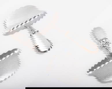 TWO STERLING SILVER HANDLED CHEESE SLICERS BY GEORGE JENSEN. Denmark, mid-century. Each in a: TWO STERLING SILVER HANDLED CHEESE SLICERS BY GEORGE JENSEN. Denmark, mid-century. Each in a different pattern. 8" long.