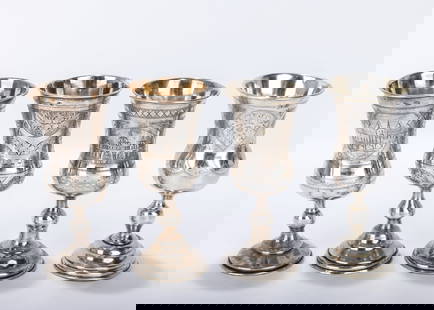 A GROUP OF FOUR RUSSIAN SILVER KIDDUSH GOBLETS. 19th century. Each one a round base with a knobbed: A GROUP OF FOUR RUSSIAN SILVER KIDDUSH GOBLETS. 19th century. Each one a round base with a knobbed stem and an outward tapering wine portion. Marked. 5.4 inches tall each. Total weight is 388 grams.