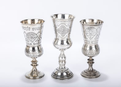 A GROUP OF THREE RUSSIAN SILVER KIDDUSH GOBLETS. 19th century. Each one a round base with a knobbed