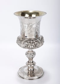 A MONUMENTAL SILVER KIDDUSH GOBLET. Warsaw, 19th century. On a round base that is engraved with a