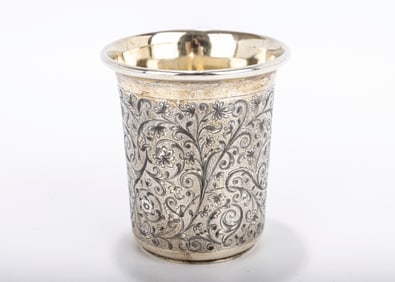 A LARGE RUSSIAN SILVER BEAKER. Russia, 1854. Highly engraved with vine and flowing designs. 3.6