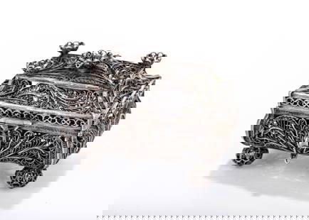 A SILVER FILIGREE SPICE CASKET. Russia, 1850. In the shape of a chest with a four sided upper: A SILVER FILIGREE SPICE CASKET. Russia, 1850. In the shape of a chest with a four sided upper portion topped with a finial. 2.7 inches by 2 inches by 2.5 inches wide.Marked 91. 94.5 grams.