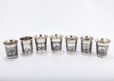 A GROUP OF SEVEN SILVER AND NIELLO BEAKERS. Russian, 19th century. Each uniquely decorated with town