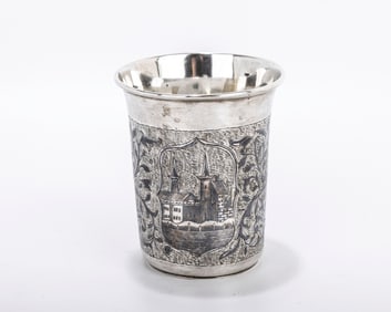 A SILVER AND NIELLO BEAKER. Russia, c. 1866. Beaker form. Decorated with a  town scene and vines.