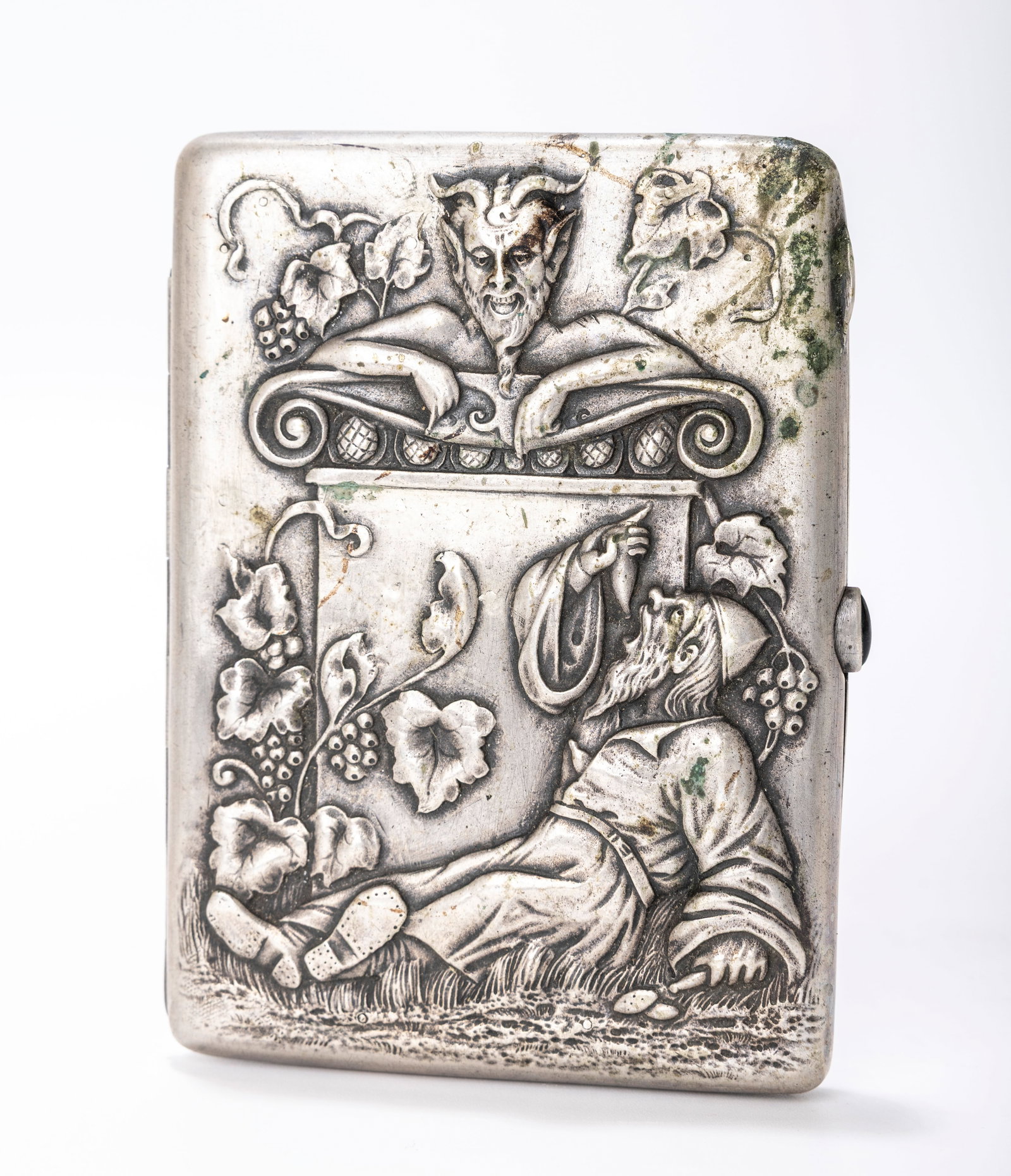 A RARE RUSSIAN EMBOSSED SILVER CIGARETTE CASE. Moscow, 1908 - 1926. Embossed with Bachus, the lord: A RARE RUSSIAN EMBOSSED SILVER CIGARETTE CASE. Moscow, 1908 - 1926. Embossed with Bachus, the lord of wine in Greek Mythology, marked with Kokoshnik marks and a maker on each side. 4.5" x 3.2" and 198