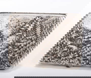 A RARE RUSSIAN EMBOSSED SILVER CIGARETTE CASE . Moscow, 1908 - 1926. Embossed with a hunter slaying: A RARE RUSSIAN EMBOSSED SILVER CIGARETTE CASE . Moscow, 1908 - 1926. Embossed with a hunter slaying a ferocious wolf in the forest on one side and a young cossack couple on the verso. Marked with Koko