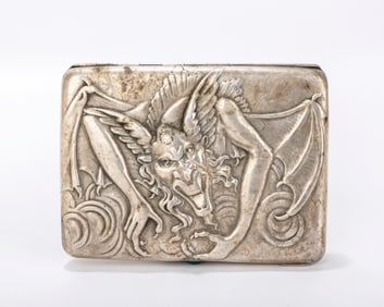 A RARE RUSSIAN EMBOSSED SILVER CIGARETTE CASE. Moscow, 1908 - 1926. Embossed with a laughing demon.