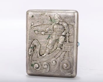 A RUSSIAN EMBOSSED SILVER CIGARETTE CASE. Russian, c. 1900. Decorated with a bearded helmsman on a