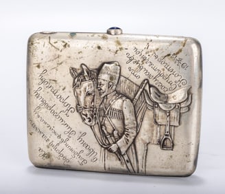 A RARE RUSSIAN EMBOSSED SILVER CIGARETTE CASE. Moscow, 1908 - 1926. Embossed with a Russian soldier