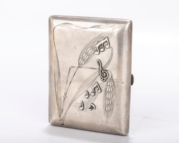 A RARE RUSSIAN SILVER CIGARETTE CASE. Moscow, 1908 - 1926. Engraved with musical and engraved
