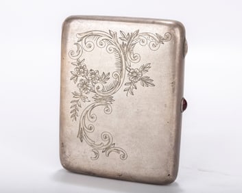 A RARE RUSSIAN SILVER CIGARETTE CASE. Moscow, Soviet era. Engraved with floral and organic designs.