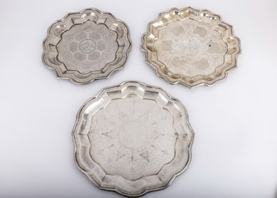 A GROUP OF 3 SILVER TRAYS. Austrian, c. 1890. Each is engraved with various town and floral designs