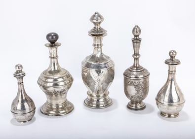 A GROUP OF 5 SILVER WINE BOTTLES. Russia, Poland and Austria, c. 1900. Each is engraved with