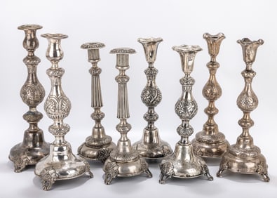 FOUR PAIRS OF RUSSIAN SILVER SABBATH CANDLESTICKS. 19th century. All on grape vine supports. Three