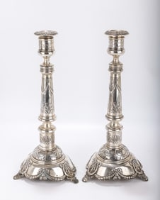 A MONUMENTAL PAIR OF SILVER SABBATH CANDLESTICKS BY JOSEF  ERLICH. Warsaw, c. 1890. On bow stems