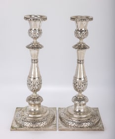 A MONUMENTAL PAIR OF SILVER SABBATH CANDLESTICKS. Poland or Russia, c. 1860. On flat bases with