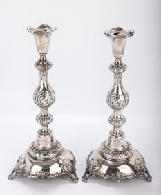 A MONUMENTAL PAIR OF SILVER SABBATH CANDLESTICKS. Poland or Russia, c. 1880. On round bases with