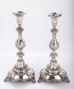 A MONUMENTAL PAIR OF SILVER SABBATH CANDLESTICKS. Poland or Russia, c. 1880. On round bases with: A MONUMENTAL PAIR OF SILVER SABBATH CANDLESTICKS. Poland or Russia, c. 1880. On round bases with grapevine leaf designs. With chased bodies in a baluster shape. Marked 84. J.Erlich and Warsaw town mar