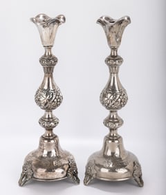 A MONUMENTAL PAIR OF SILVER SABBATH CANDLESTICKS BY SZEKMAN. Warsaw, 1895. On raised bases with