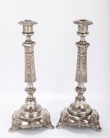 A MONUMENTAL PAIR OF SILVER SABBATH CANDLESTICKS. Warsaw, c. 1890. On round bases with grapevine