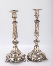 A PAIR OF SILVER CANDLESTICKS. Warsaw, c. 1890. On round bases with grapevine leaf designs. With