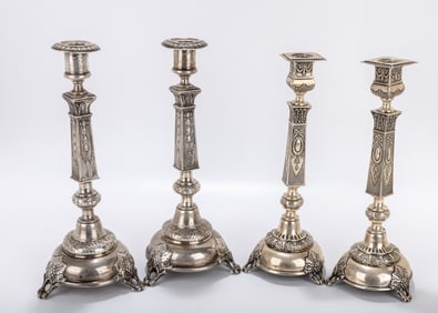 TWO PIARS OF SILVER SABBATH CANDLESTICKS. Warsaw, c. 1890. All with grape vine support round domed