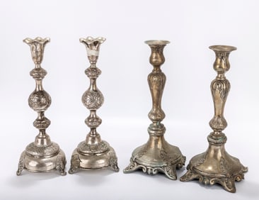 TWO PAIRS OF SILVER SABBATH CANDLESTICKS. Austria and Warsaw, c. 1890. Both are weighted with