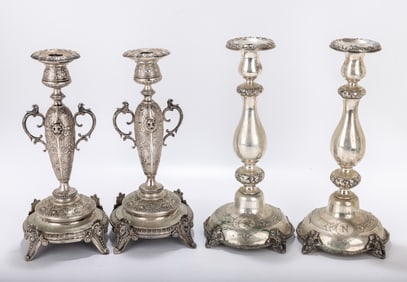 TWO PAIRS OF SILVER SABBATH CANDLESTICKS. Austria and Poland, c. 1890.. One pair is gothic in form