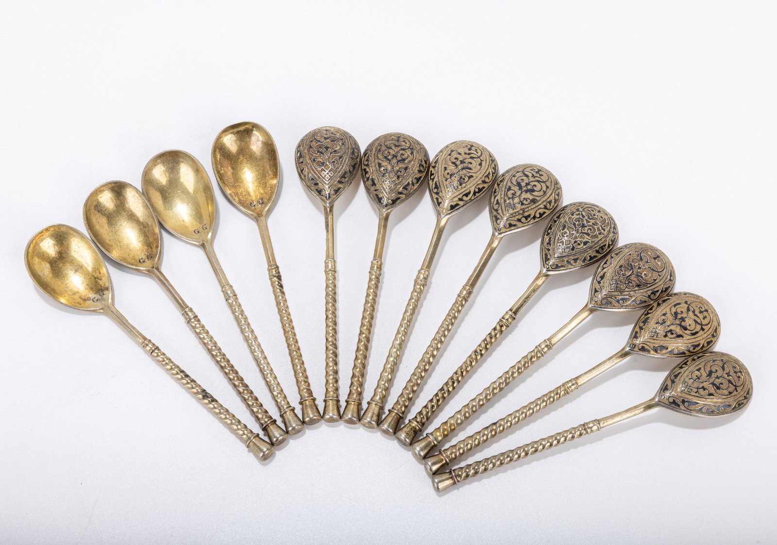 A GROUP OF 12 MATCHING SILVER AND NIELLO TEA SPOONS. Russia, c. 1880. Marked only with an early 84 (1 of 10)