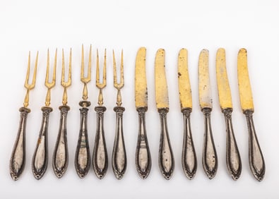 A SERVICE FOR 6 COCKTAIL SET. Germany, c. 1900.  Consisting of silver handles and gilded upper