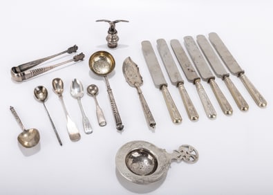 A GROUP OF RUSSIAN SILVER TABLE FLATWARE. Including tea strainers, sugar tongs, a tea shovel and