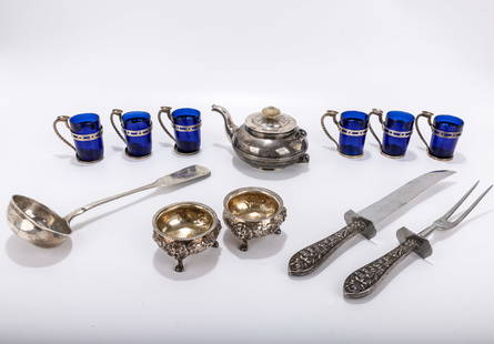 A GROUP OF SILVER TABLEWARE. Including a  Russian silver teapot, a Russian silver soup ladle, six: A GROUP OF SILVER TABLEWARE. Including a Russian silver teapot, a Russian silver soup ladle, six cobalt glass and silver tea cups, two American coin silver master salts and a silver handled carving se