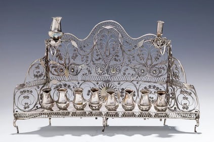AN EARLY BAAL SHEM TOV FILIGREE HANUKKAH LAMP