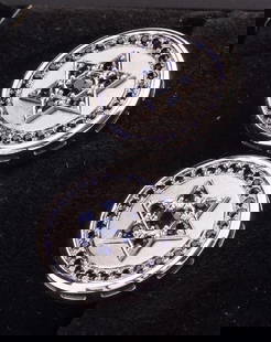 A PAIR OF 14K WHITE GOLD ISRAELI STAR OF DAVID CUFFLINKS.: Israel, modern. Decorated with hand cut blue sapphires