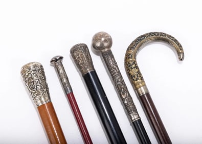 A GROUP OF FIVE SILVER HANDLED DRESS CANES. India and Middle Eastern, c. 1900.