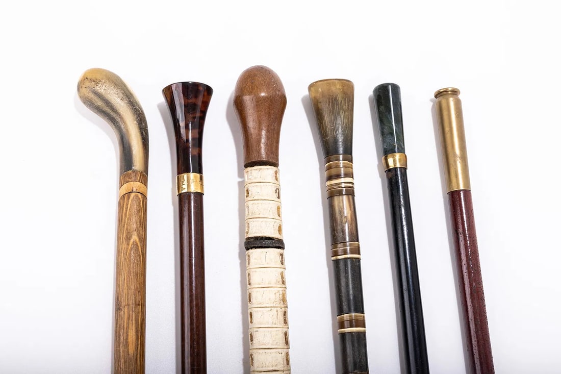 A GROUP OF SIX DRESS CANES - WALKING STICKS. Various ages and origins.: A GROUP OF SIX DRESS CANES - WALKING STICKS. Various ages and origins. Of various forms which include traditional wooden grips and carved antlers. Most are about 36" long.