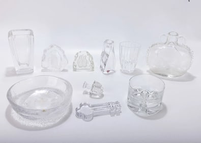 A GROUP OF GLASS AND CRYSTAL TABLE ACCESSORIES. Including bowls, a bottle, vases and cups. Various