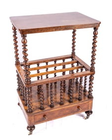 A VICTORIAN WALNUT CANTERBURY. Most Likely Great Britain, c. 1860. On four apparently original wheel