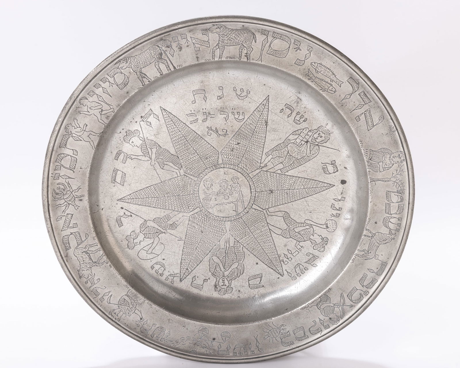 5. A LARGE PEWTER SEDER TRAY. Germany, 1792 The center is engraved with a seder table in a six (1 of 1)