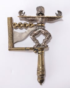 9. A LARGE BRASS GRAGGER. Probably American, 20th century. With a spinning noise maker that