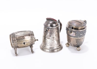 19. A GROUP OF THREE CHARITY/COLLECTION CONTAINERS. Mostly Germany, c. 1900. One shaped like a wine